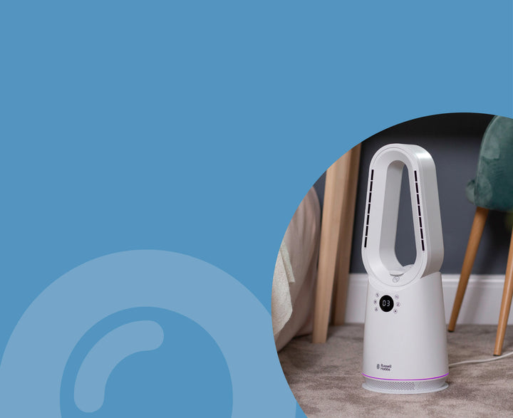 White fan on a gray floor with a blue gradient background
