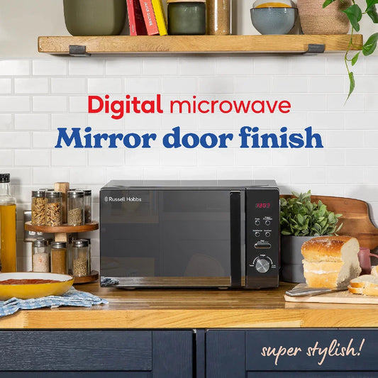Digital microwave with mirror door finish on a kitchen counter, surrounded by kitchen items.